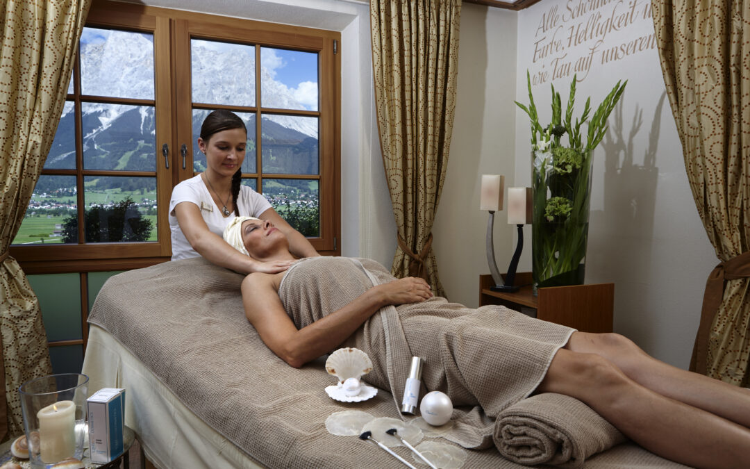 Lady lying on couch receives massage
